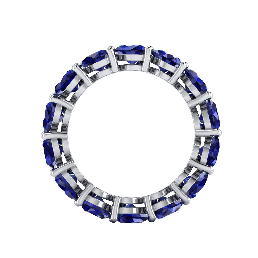 Close-up of Amour Blue Sapphire Eternity Band's gemstones.