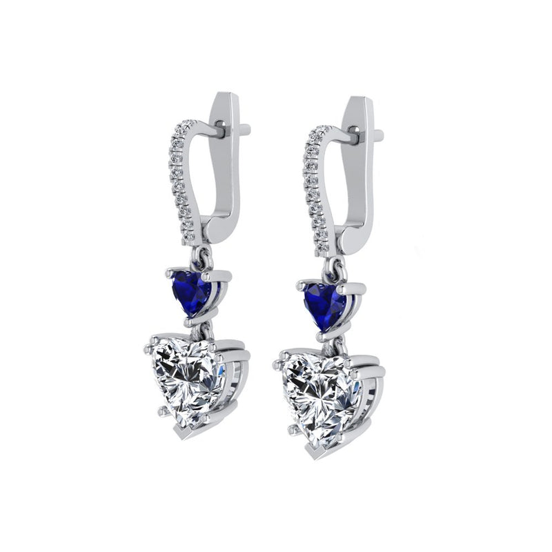 Close-up of Amour Blue Sapphire Drop Earrings showcasing heart-shaped centerpiece.