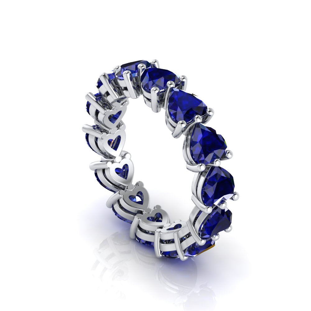 Heart-shaped blue sapphire stones on Amour Blue Sapphire Eternity Band.